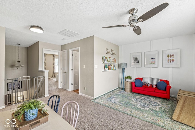 12259 Sweet Creek Trl, Fishers, IN 46037 - dining room with carpet, ceiling fan, and a textured ceiling