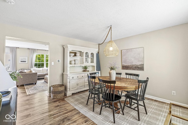 12259 Sweet Creek Trl, Fishers, IN 46037 - dining space with wood finished floors and a textured ceiling