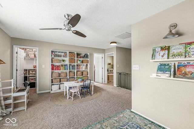 12259 Sweet Creek Trl, Fishers, IN 46037 - rec room featuring carpet floors, a ceiling fan, and a textured ceiling