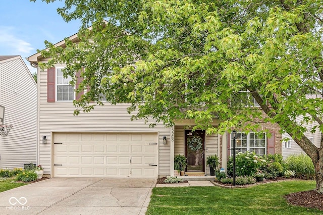 12259 Sweet Creek Trl, Fishers, IN 46037 - obstructed view of property with driveway, a front yard, and a garage