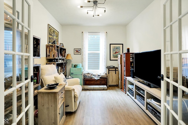 2612 Ruffian Dr, Westfield, IN 46074 - sitting room with french doors, wood finished floors, and a chandelier
