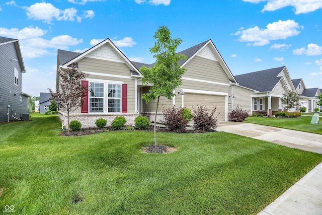 2612 Ruffian Dr, Westfield, IN 46074 - view of front of home with concrete driveway, a front lawn, an attached garage, brick siding, and roof with shingles