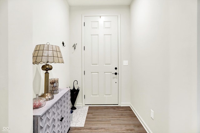 2612 Ruffian Dr, Westfield, IN 46074 - doorway featuring wood finished floors and baseboards