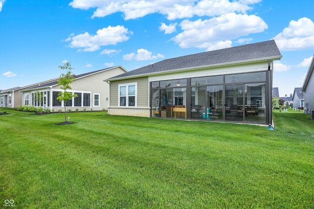 2612 Ruffian Dr, Westfield, IN 46074 - rear view of property featuring a sunroom, a yard, and brick siding