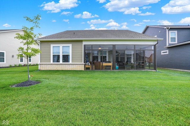 2612 Ruffian Dr, Westfield, IN 46074 - back of house featuring a lawn, a sunroom, and roof with shingles