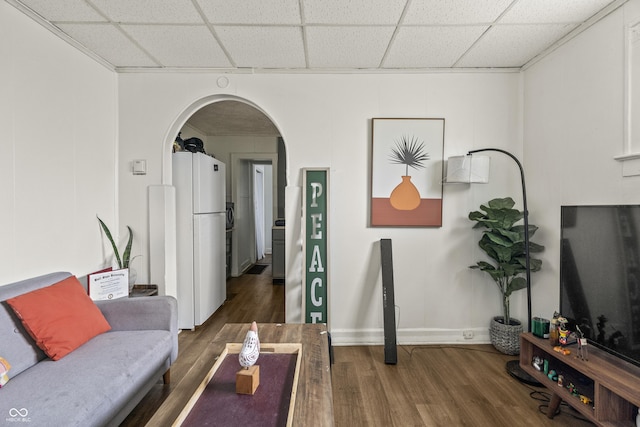 1849 E Minnesota St, Indianapolis, IN 46203 - living room featuring a paneled ceiling, wood finished floors, and arched walkways