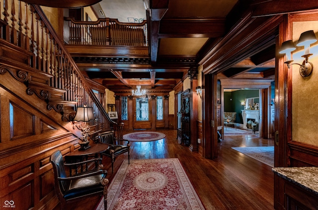 825 E Washington St, Muncie, IN 47305 - foyer entrance with coffered ceiling, dark wood-style flooring, stairs, ornamental molding, and beam ceiling