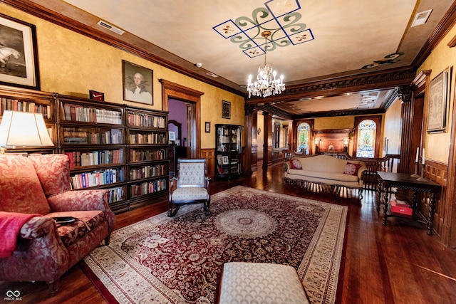 825 E Washington St, Muncie, IN 47305 - living area with crown molding, hardwood / wood-style floors, a chandelier, and wainscoting
