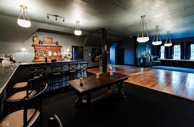825 E Washington St, Muncie, IN 47305 - indoor bar with wood finished floors and pendant lighting