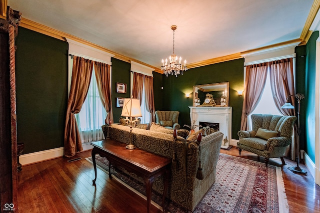 825 E Washington St, Muncie, IN 47305 - living room with a chandelier, a fireplace, hardwood / wood-style floors, and crown molding