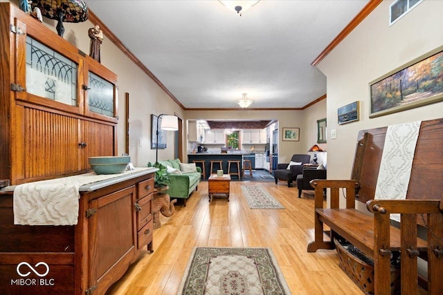 6975 Milhouse Rd, Indianapolis, IN 46221 - foyer with crown molding and light wood-style flooring
