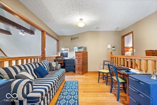 6975 Milhouse Rd, Indianapolis, IN 46221 - living area featuring light wood finished floors and a textured ceiling