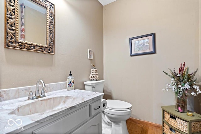 6975 Milhouse Rd, Indianapolis, IN 46221 - half bath featuring wood finished floors and vanity