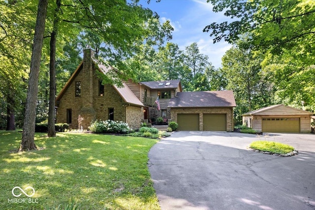 6975 Milhouse Rd, Indianapolis, IN 46221 - view of front of home with stone siding, a front lawn, a chimney, and a detached garage