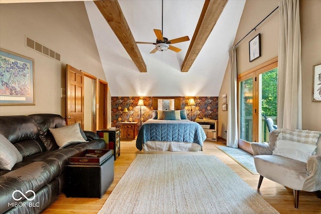 6975 Milhouse Rd, Indianapolis, IN 46221 - bedroom with high vaulted ceiling, access to outside, beam ceiling, and light wood finished floors