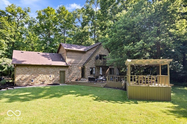 6975 Milhouse Rd, Indianapolis, IN 46221 - rear view of house featuring a lawn, stone siding, a deck, and a shingled roof