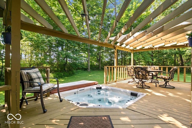 6975 Milhouse Rd, Indianapolis, IN 46221 - deck featuring a covered hot tub, a pergola, a lawn, and view of wooded area