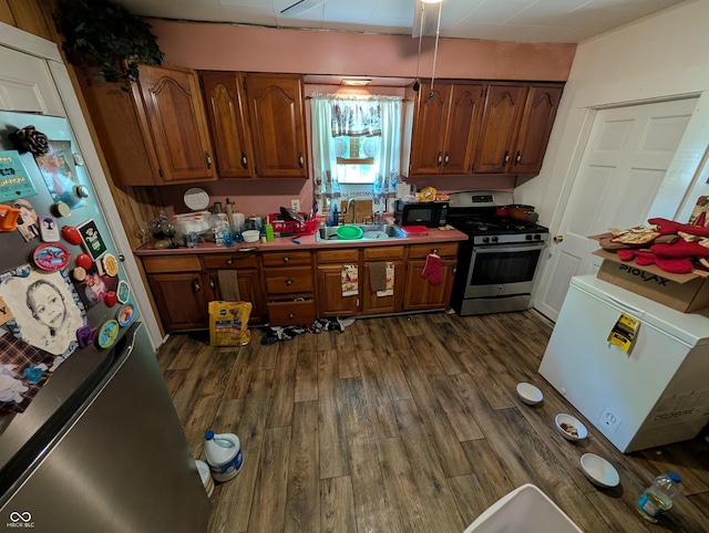 1609 Brown St, Anderson, IN 46016 - kitchen featuring stainless steel appliances, dark wood-type flooring, and brown cabinets