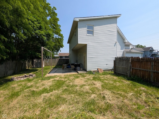 1609 Brown St, Anderson, IN 46016 - back of property with a patio and a fenced backyard