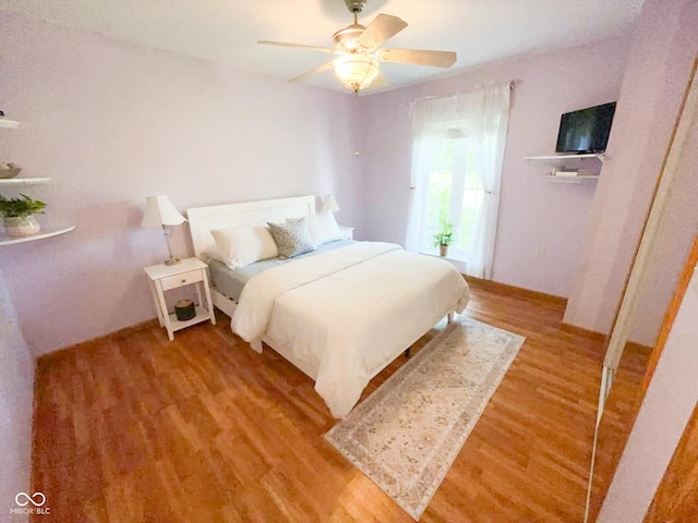 14266 S 125 E, Clinton, IN 47842 - bedroom featuring light wood finished floors and ceiling fan