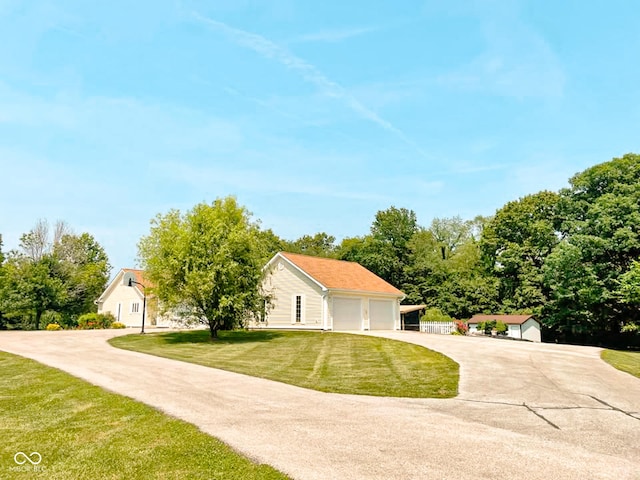 14266 S 125 E, Clinton, IN 47842 - view of front of property with a front yard, a garage, an outbuilding, and driveway