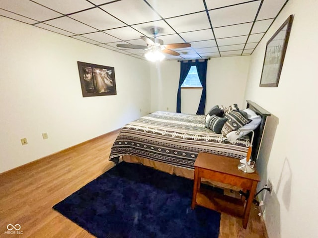 14266 S 125 E, Clinton, IN 47842 - bedroom with wood finished floors, a drop ceiling, and a ceiling fan