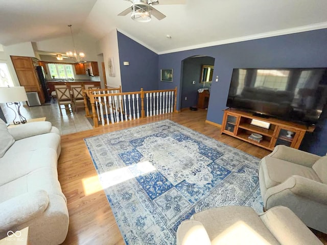 14266 S 125 E, Clinton, IN 47842 - living area with ceiling fan, arched walkways, light wood-style floors, vaulted ceiling, and crown molding