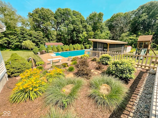 14266 S 125 E, Clinton, IN 47842 - swimming pool featuring a sunroom and view of wooded area