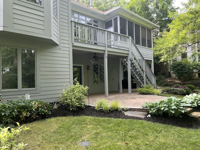 8069 Middle Bay Ln, Indianapolis, IN 46236 - rear view of house featuring a patio, a ceiling fan, a sunroom, stairs, and a yard