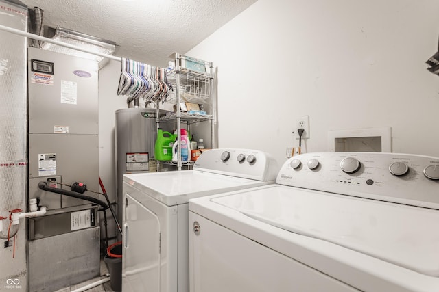 1112 Halifax Ct, Indianapolis, IN 46231 - washroom with washing machine and dryer, heating unit, and a textured ceiling
