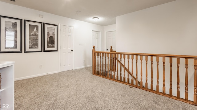 1112 Halifax Ct, Indianapolis, IN 46231 - hallway with carpet flooring and an upstairs landing