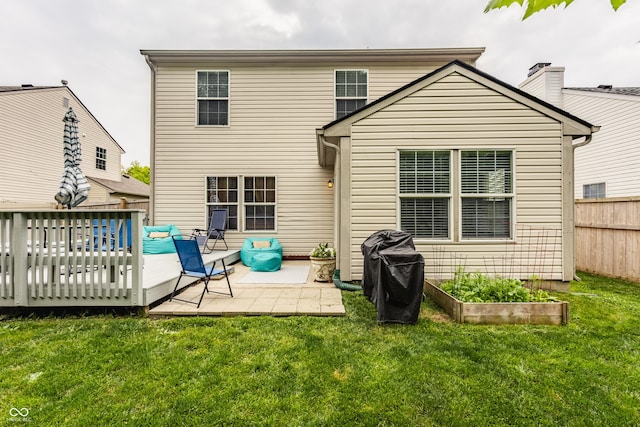1112 Halifax Ct, Indianapolis, IN 46231 - rear view of house with a wooden deck, a patio, a garden, and a chimney