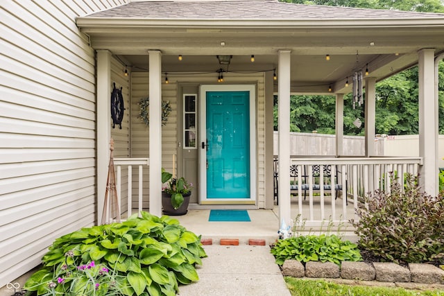 1112 Halifax Ct, Indianapolis, IN 46231 - view of exterior entry featuring a porch and a shingled roof