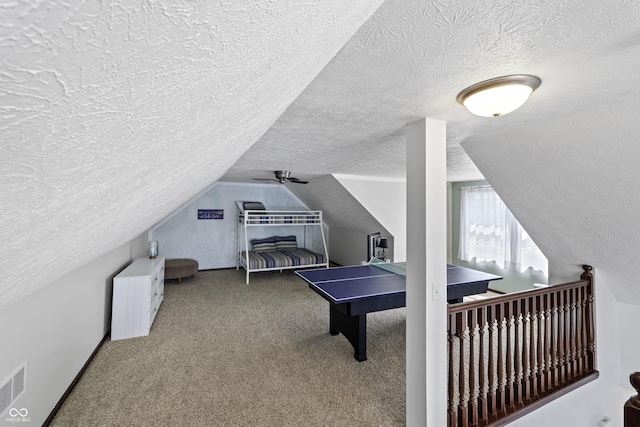 5823 E Sheridan Rd, Monticello, IN 47960 - recreation room featuring a textured ceiling, lofted ceiling, and carpet floors