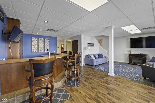 5823 E Sheridan Rd, Monticello, IN 47960 - indoor bar featuring wood finished floors, a paneled ceiling, and stairway