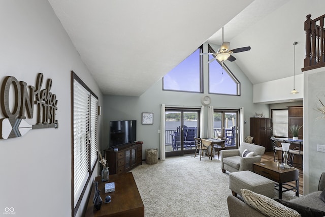 5823 E Sheridan Rd, Monticello, IN 47960 - carpeted living room with a ceiling fan, healthy amount of natural light, high vaulted ceiling, and french doors