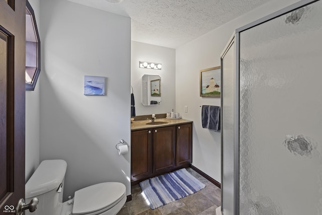 5823 E Sheridan Rd, Monticello, IN 47960 - bathroom featuring a shower stall, vanity, a textured ceiling, and stone finish flooring