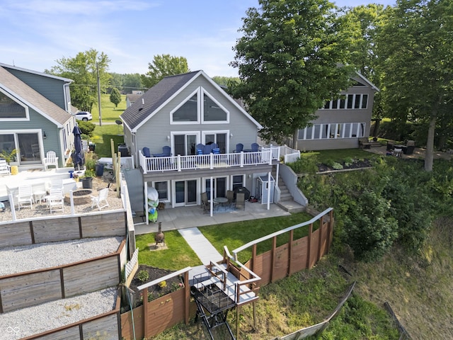 5823 E Sheridan Rd, Monticello, IN 47960 - back of house with a patio, stairs, a wooden deck, a fenced backyard, and a garden