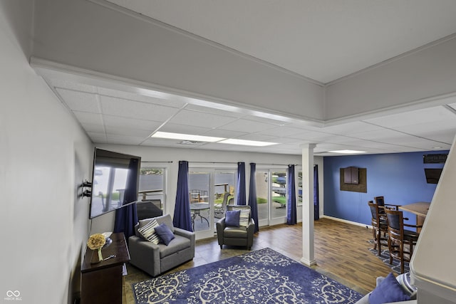 5823 E Sheridan Rd, Monticello, IN 47960 - living room with plenty of natural light, a drop ceiling, and wood finished floors
