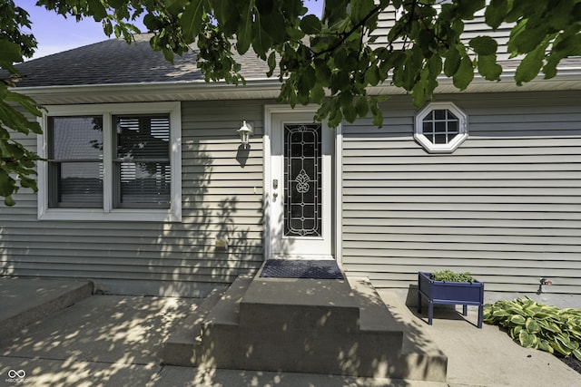 5823 E Sheridan Rd, Monticello, IN 47960 - doorway to property featuring roof with shingles