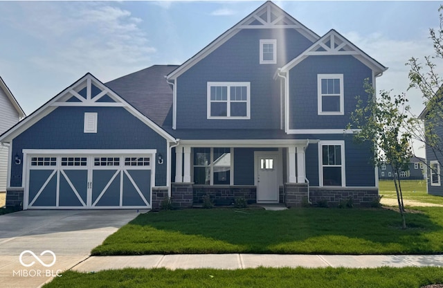 18955 Seaforth Way, Westfield, IN 46074 - craftsman inspired home featuring driveway, stone siding, a front lawn, and an attached garage