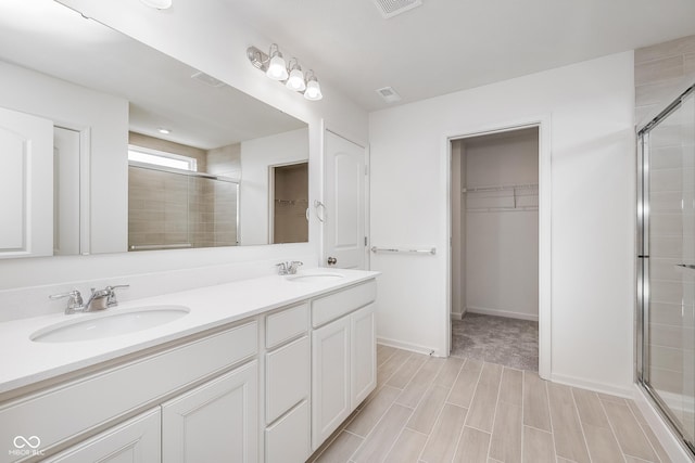 18955 Seaforth Way, Westfield, IN 46074 - full bath with a spacious closet, a stall shower, double vanity, and wood finished floors