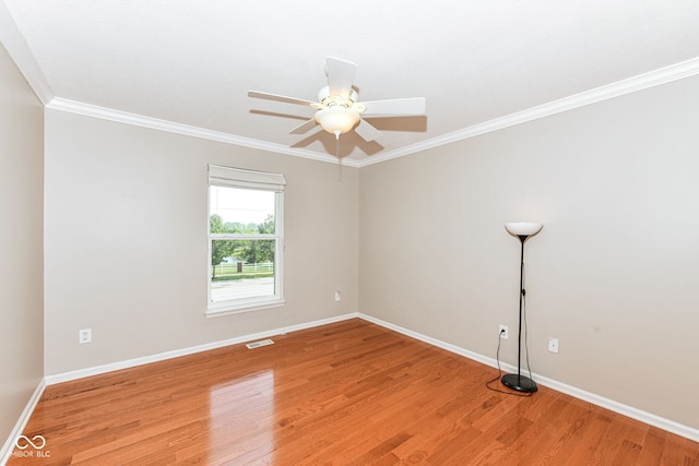 14109 Secretariat Ct, Carmel, IN 46074 - spare room with light wood-style floors, crown molding, and a ceiling fan