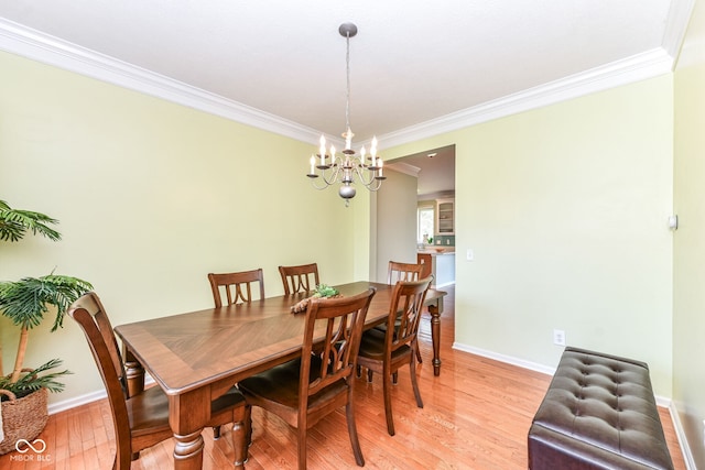 14109 Secretariat Ct, Carmel, IN 46074 - dining room with ornamental molding, a chandelier, and light wood-style floors