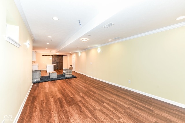 14109 Secretariat Ct, Carmel, IN 46074 - unfurnished living room featuring a barn door, crown molding, wood finished floors, and recessed lighting