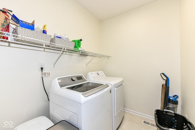 14109 Secretariat Ct, Carmel, IN 46074 - washroom with independent washer and dryer and light tile patterned flooring