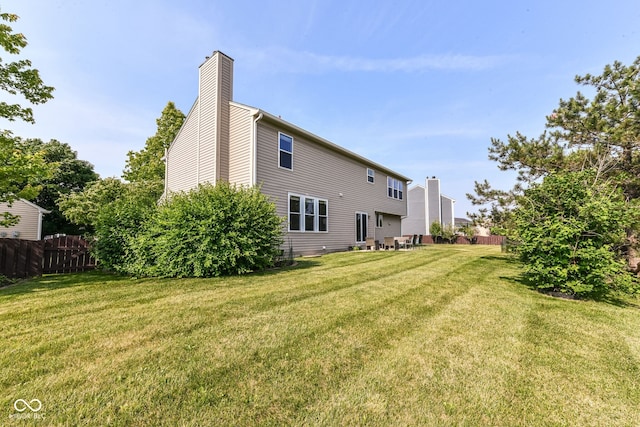 14109 Secretariat Ct, Carmel, IN 46074 - rear view of property featuring a chimney