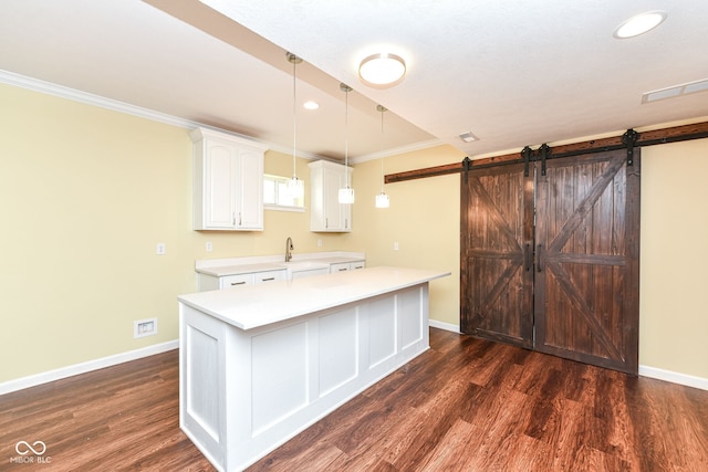 14109 Secretariat Ct, Carmel, IN 46074 - kitchen with light countertops, white cabinetry, dark wood-style flooring, recessed lighting, and ornamental molding
