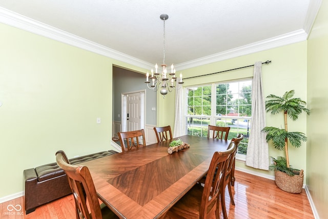 14109 Secretariat Ct, Carmel, IN 46074 - dining space featuring crown molding, a chandelier, and light wood-style flooring