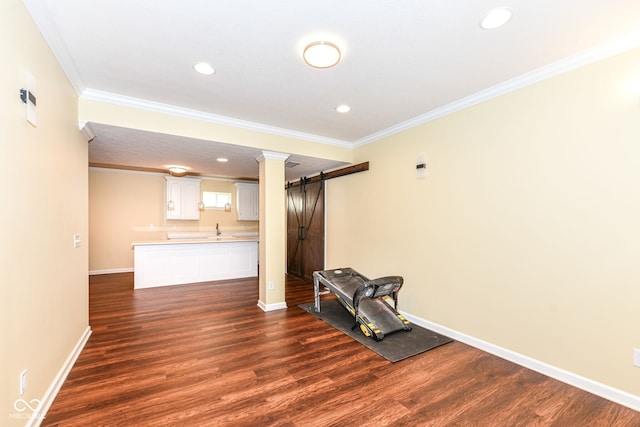 14109 Secretariat Ct, Carmel, IN 46074 - unfurnished living room featuring a barn door, dark wood-type flooring, crown molding, and recessed lighting